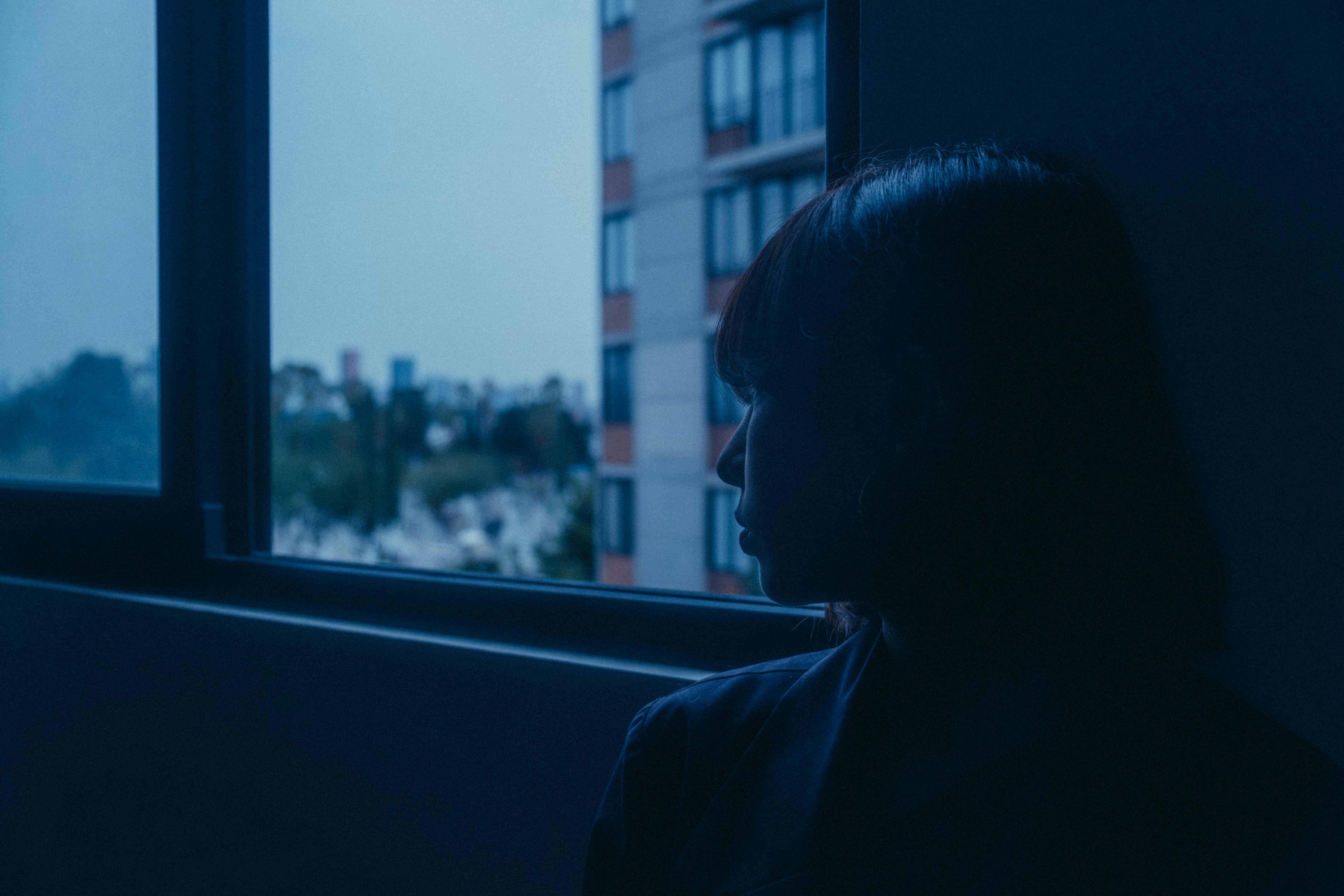 Emotional disconnection in relationship shown through quiet reflective moment at home