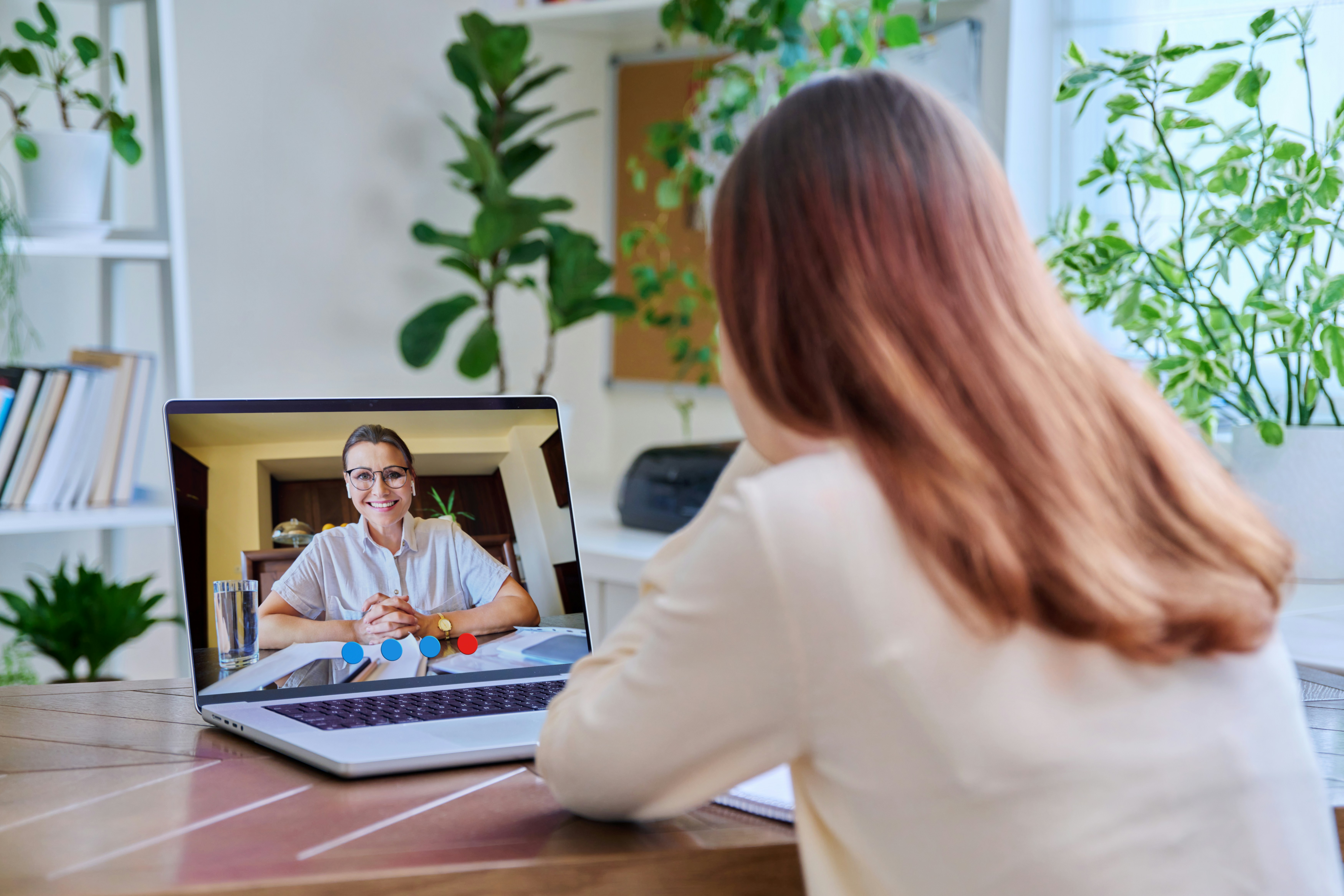Person having a virtual therapy session on a laptop at home in Ontario