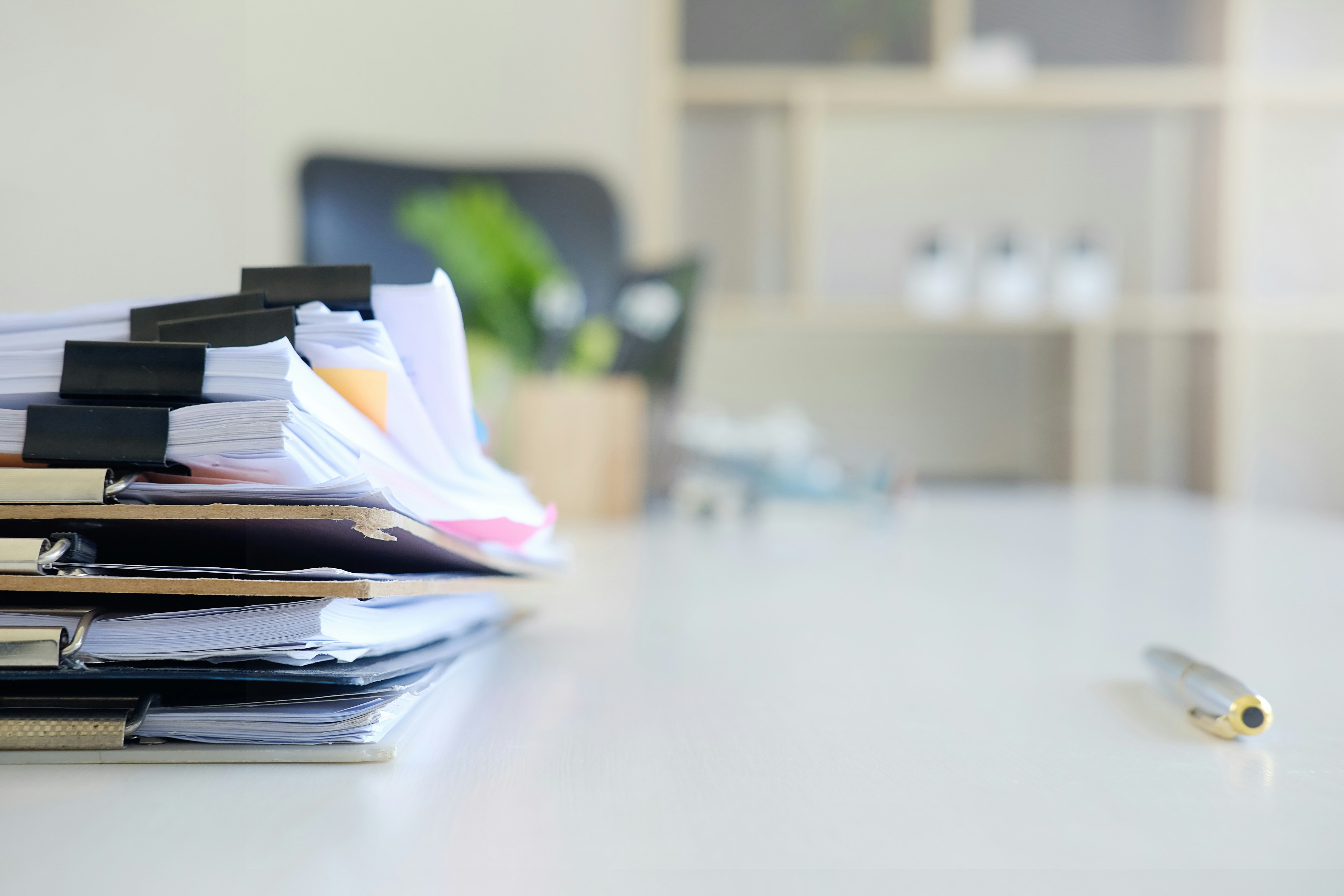 A stack of documents related to extended health benefits for psychologists in Ontario 